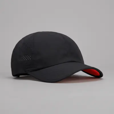 Igicu Vent Cap in black with laser-cut vents and an orange under-brim